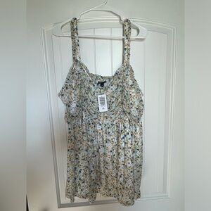 Torrid brand top. Floral with a white connected under shirt. Size 3.
